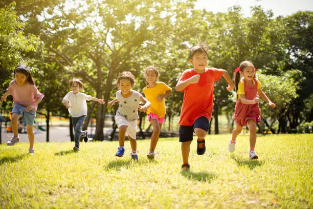 A group of young children running together